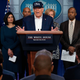 President Donald Trump, surrounded by members of the White House’s Coronavirus Task Force, discusses the national emergency at a Saturday press conference.